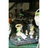 A set of scales, horseshoe ornament, pair oak candlesticks and a trivet