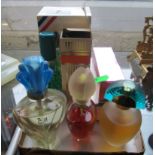 Various perfume bottles and perfume.