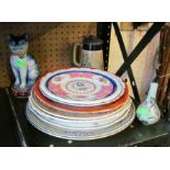 Various decorative plates, a pottery cat etc