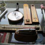 A retro barometer, lighter and three thermometers