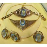 A foreign gold jewellery set with aquamarine stones; pair earrings, necklet, bracelet and ring