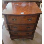 A walnut chest of three drawers