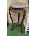 A mahogany marble top jardinière stand