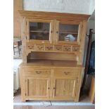 A lightwood kitchen dresser