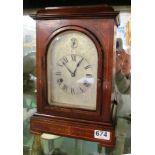 An Edwardian mahogany mantel clock eight day striking movement