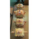 Four novelty cottage teapots