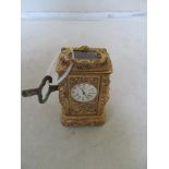 A small gilt metal carriage clock
