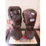 A pair of carved African treen busts man and lady