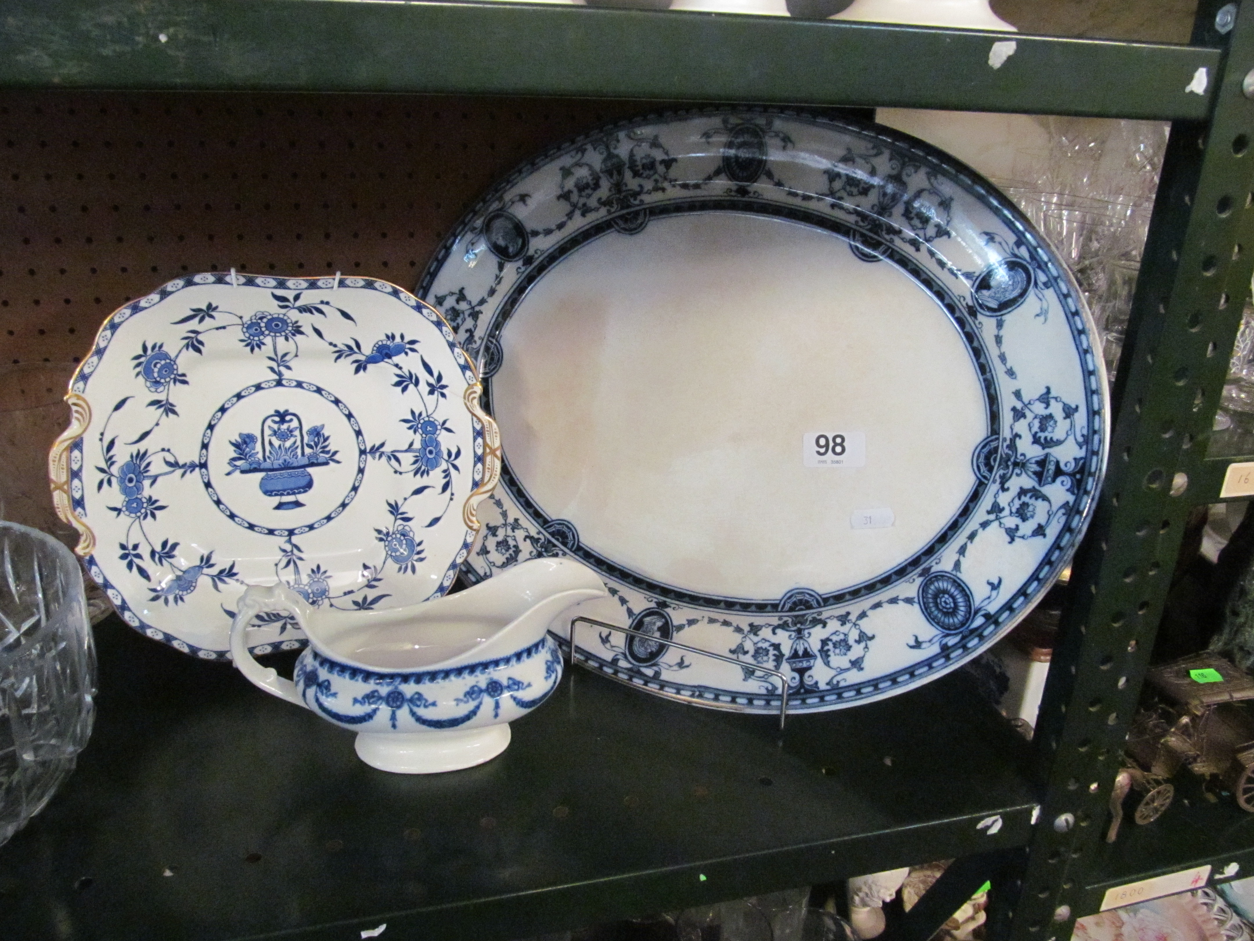 A blue and white platter, a plate and jug