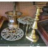 A brass pestle and mortar and brass items