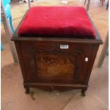 An inlaid piano stool with side music storage