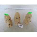 Three mid-size brown SylvaC sad dogs
