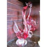 Two red glass birds
