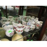 Twelve Royal Worcester ironstone jugs and shelf unit with centigrade