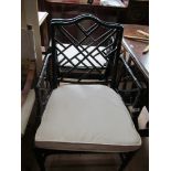 A pair of black bamboo effect chairs.