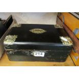 A brass and black fitted jewellery box.