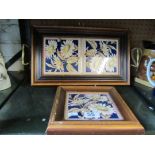 A two handled tile tray and a similar teapot stand