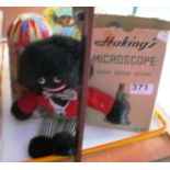 A Hakings microscope, printed football, Helter Skelter and Golly toy