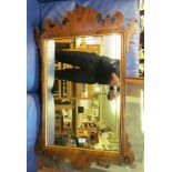 A walnut fret frame mirror