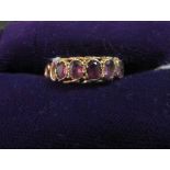 An Edwardian purple stone ring, marked 12, .5