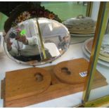 An Arts and Crafts style oak extending bookslide and a bevelled barbola dressing table mirror