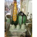 A green pottery condiment stand, green petal shade and green and gilt Venetian glass decanter (no