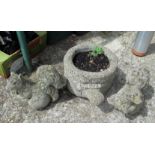Two squirrel garden ornaments and a planter