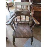 A 19th Century elm kitchen chair with turned back rails and a painted Regency style chair cane seat