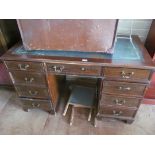 A reproduction desk of nine drawers