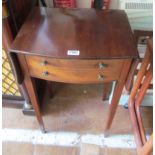 A mahogany bow front bedside table with flaps