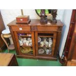 A mahogany two door cabinet with two frieze drawers