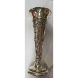 A silver spill vase embossed design