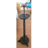 A 19th Century lace makers candle stand on carved twist stem and scroll feet