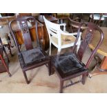 A pair of Chinese hardwood chairs with pierced floral panel