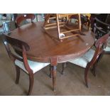 A 19th Century circular top dining table on tapered supports
