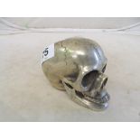 A reproduction silver coloured skull with hinged mouth