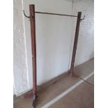 An unusual coat stand opening out to form a clothes rail