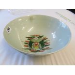 A Chinese famille verte bowl with fighting figures on horseback