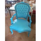 A turquoise upholstered French style chair