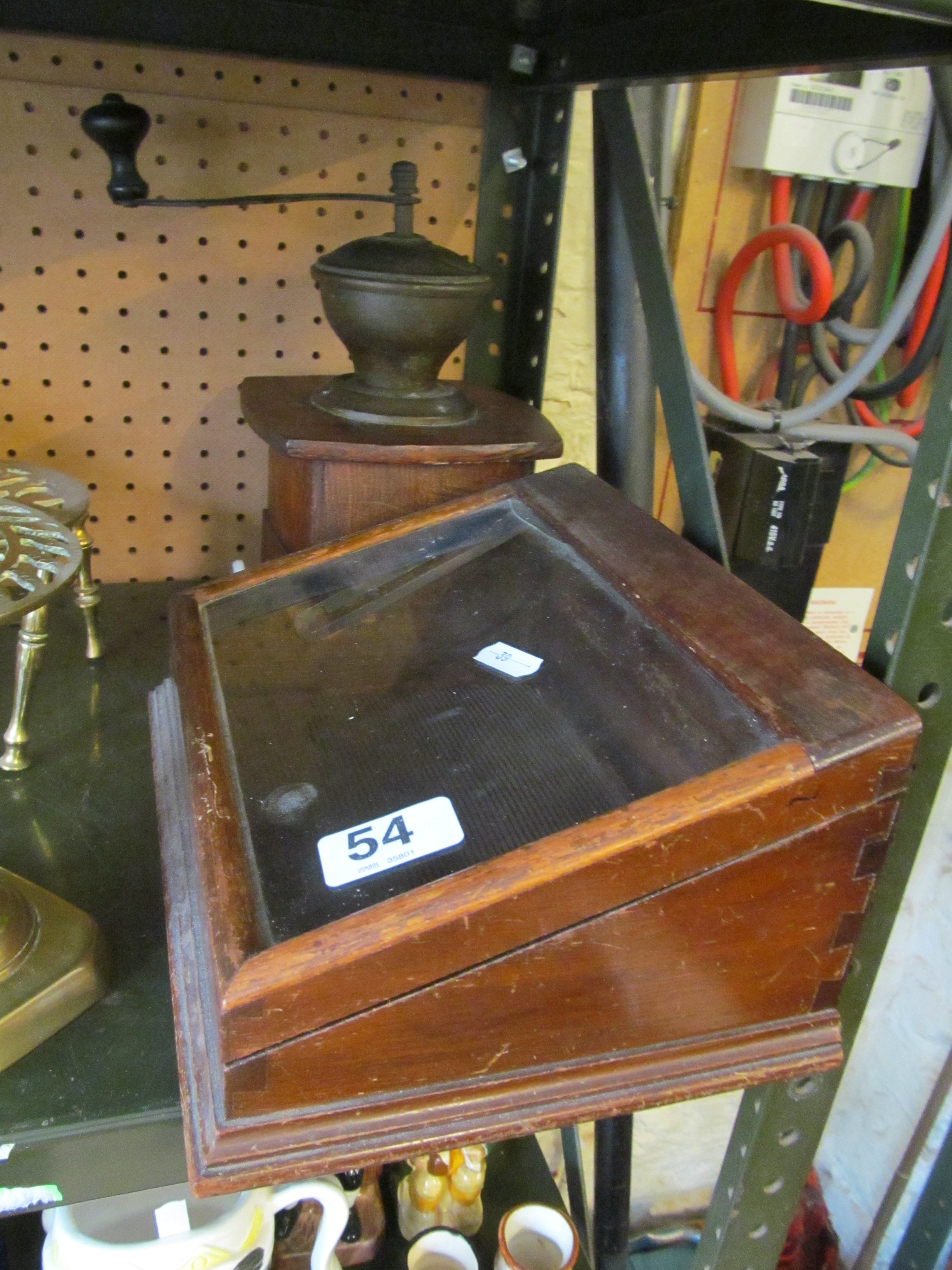 A coffee grinder and small cabinet