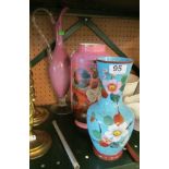 A Victorian pink glass vase decorated flowers, another similar blue one and a tall pink glass jug