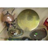 A gong, porthole mirror, copper dish and copper kettle on stand