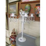 A pair of modern white candelabra with lustre drops