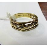 A 9ct gold ring with three greyhound design