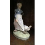 A Lladro figure goose girl