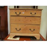 A small Victorian pine chest of three drawers on bracket feet