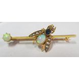 A gold inset brooch with opals