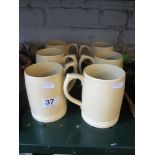 Six cream Keith Murray Wedgwood mugs (one slight hair line crack)