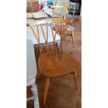 Two Ercol light wood chairs