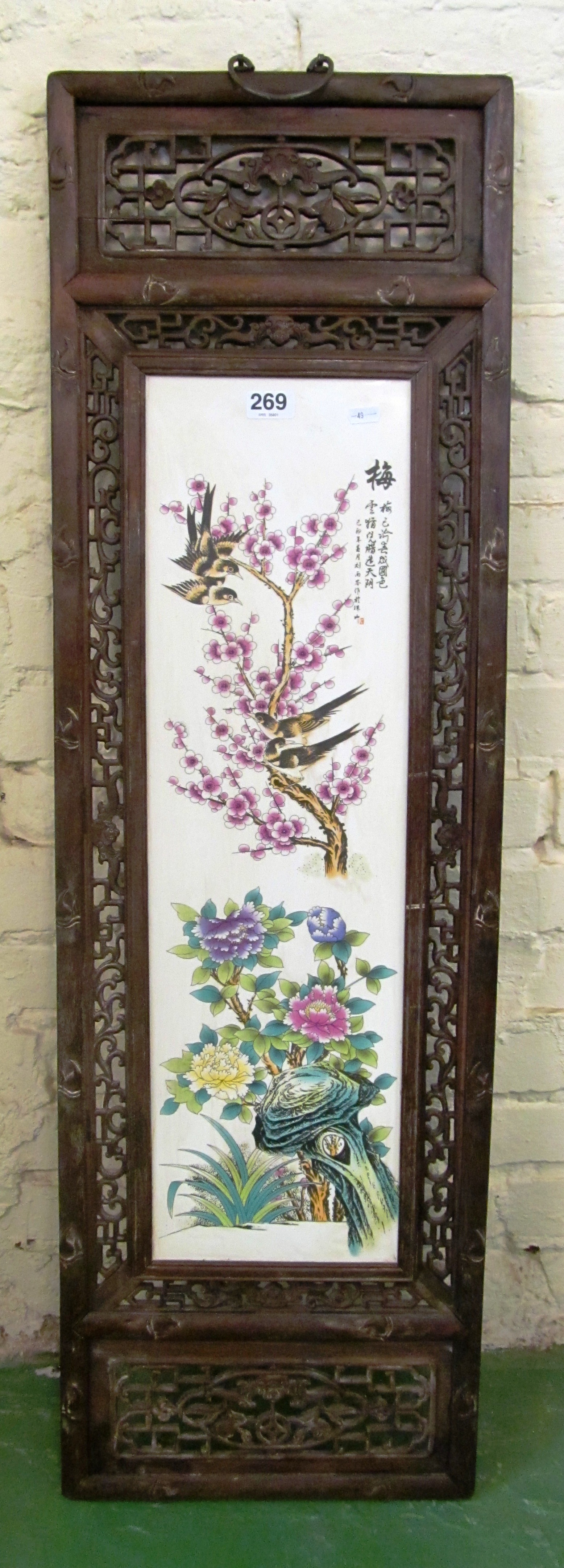 A pair of Oriental porcelain panels birds in trees and birds nest in pierced frame